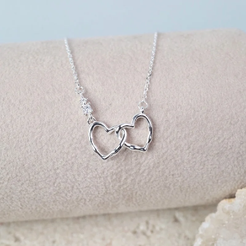 Trendy Coin Necklaces For Bold Style-Sterling Silver Interlocking Hearts Necklace